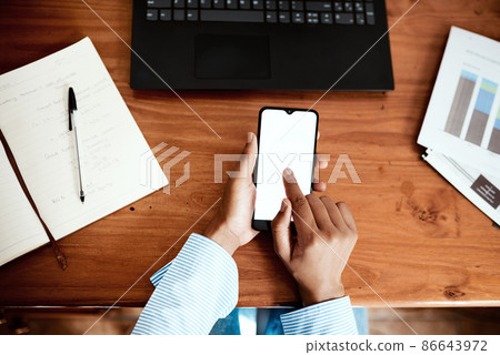 Get more done with good network coverage. Cropped shot of a businesswoman using a smartphone while going over financial paperwork at her desk. Get more done with good network coverage. Cropped shot of a businesswoman using a smartphone while going over financial paperwork at her desk. 86643972