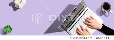 Person using a laptop computer Person using a laptop computer 86644118