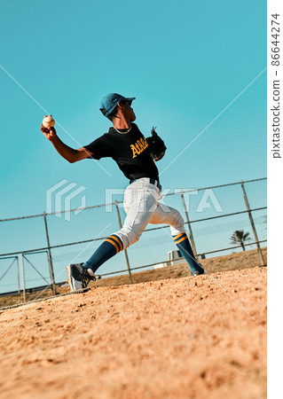 Pitchers are often the best all-around athletes on the team. Shot of a young baseball player pitching the ball during a game outdoors. Pitchers are often the best all-around athletes on the team. Shot of a young baseball player pitching the ball during a game outdoors. 86644274