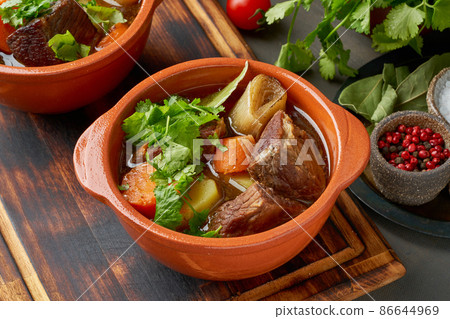 Goulash with large pieces of beef and vegetables. Slow stewing, cooking in two pot or cast-iron pan Goulash with large pieces of beef and vegetables. Slow stewing, cooking in two pot or cast-iron pan 86644969