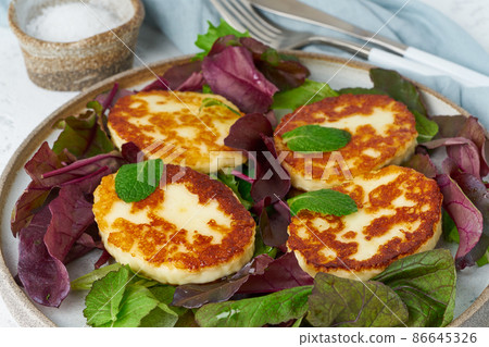 Cyprus roasted halloumi with salad mix, beet tops. Lchf, pegan, fodmap Cyprus roasted halloumi with salad mix, beet tops. Lchf, pegan, fodmap 86645326