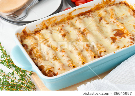 Cannelloni pasta with filling of ground beef, tomatoes, baked with bechamel 86645997