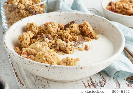 Yogurt with Granola. Breakfast, healthy diet food. Side view, close up 86646102