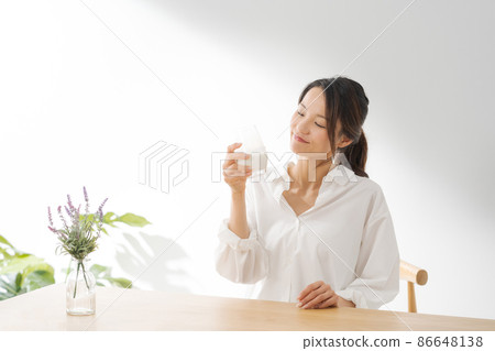 Female drinking milk white background 86648138