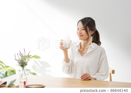 Female drinking milk white background 86648140