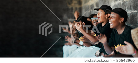 Cheering on their team. Cropped shot of a group of young baseball players cheering and supporting their team from the bench during a game. Cheering on their team. Cropped shot of a group of young baseball players cheering and supporting their team from the bench during a game. 86648960