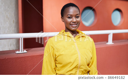 A healthy mind, an easy life. Portrait of a young woman working out against an urban background. A healthy mind, an easy life. Portrait of a young woman working out against an urban background. 86649182