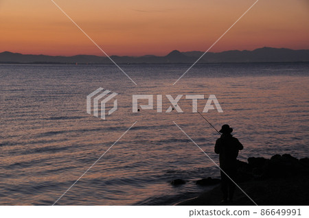 Angler before dawn on Lake Biwa Angler before dawn on Lake Biwa 86649991