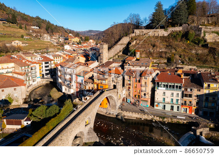 Autumn view of mountainous Spanish town of Camprodon in Pyrenees on Ter river Autumn view of mountainous Spanish town of Camprodon in Pyrenees on Ter river 86650759