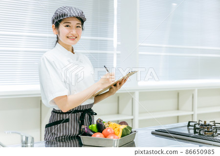 Female checking food (check) 86650985