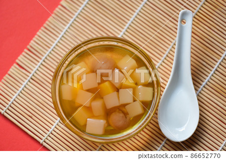 Chinese desserts, Mix ginkgo nuts cassava syrup coconut jelly in longan juice on glass bowl, Thai and Chinese longan date soup Asian dessert sweets Chinese desserts, Mix ginkgo nuts cassava syrup coconut jelly in longan juice on glass bowl, Thai and Chinese longan date soup Asian dessert sweets 86652770