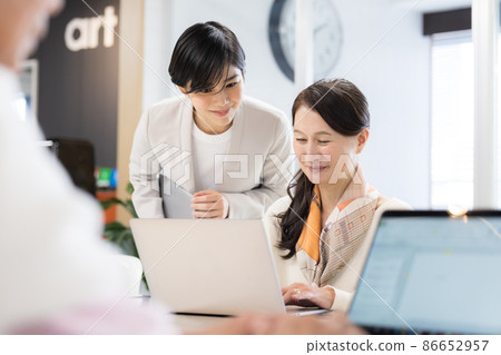 Senior female working in a shared office Senior female working in a shared office 86652957