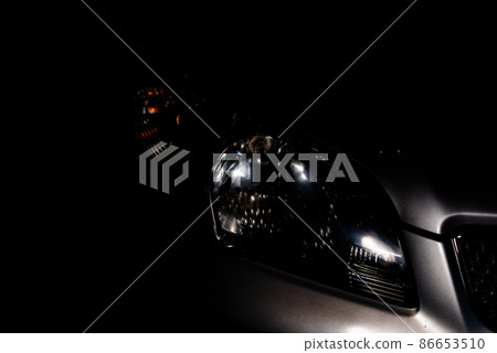 car headlight headlight of modern prestigious car close up. 86653510