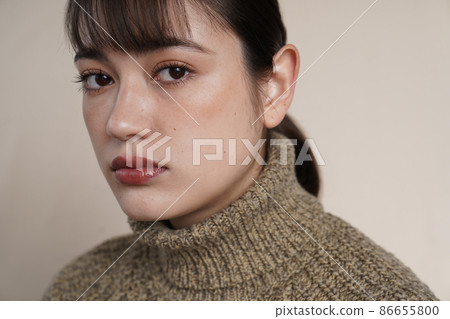 Shaded portrait of a woman in a sweater 86655800
