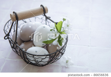 A basket with Easter eggs A basket with Easter eggs 86656636
