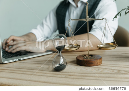 Male lawyer working with contract papers and wooden gavel on tabel in courtroom. justice and law ,attorney, court judge, concept. 86656776