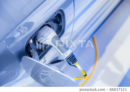 electricity car or EV car plug in power charging at power station future driving concept electricity car or EV car plug in power charging at power station future driving concept 86657321