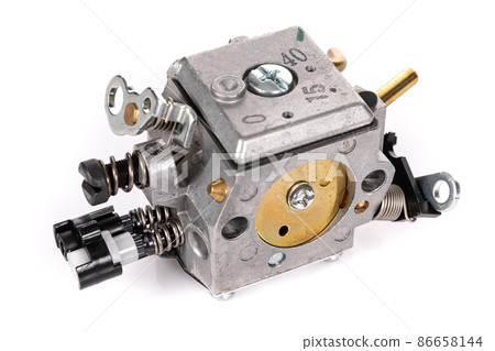 new carburetor for garden trimmer on white isolated background new carburetor for garden trimmer on white isolated background 86658144