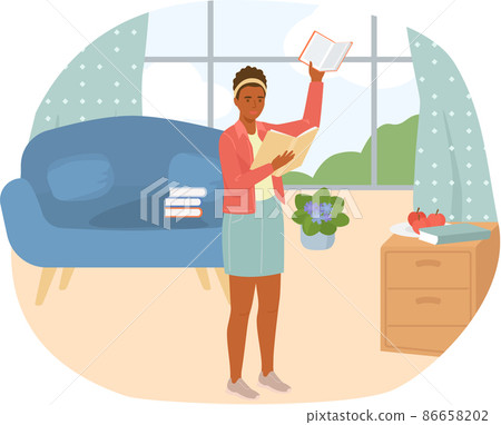 Young woman reading book standing near stack of books in living room, studying at home Young woman reading book standing near stack of books in living room, studying at home 86658202