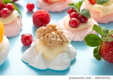 Pavlova meringue cake with walnut  blue background 86658456