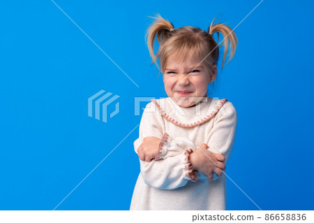 Naughty little girl over the blue background 86658836
