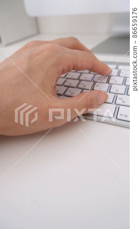 Hand hitting the keyboard 86659176