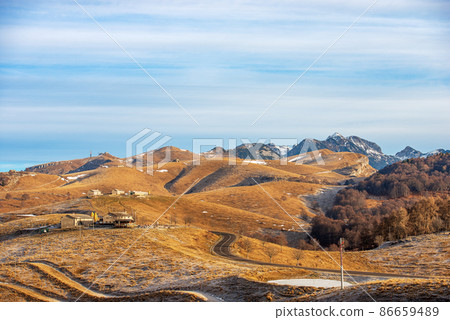 Panoramic view of Lessinia Plateau and Mountain Range of Monte Carega - Italy Alps 86659489