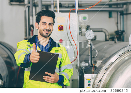 portrait latin smart engineer happy smile thumbs up working in factory portrait latin smart engineer happy smile thumbs up working in factory 86660245