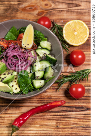 salad mix with avocado and cucumber, with balsamic dressing salad mix with avocado and cucumber, with balsamic dressing 86660719