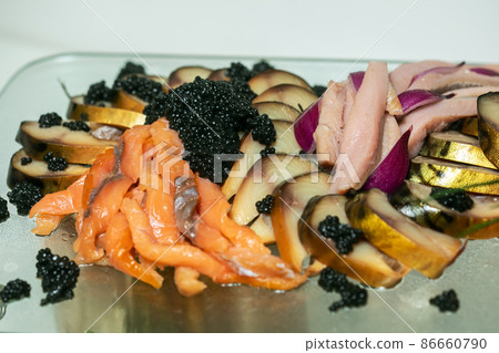 Fish plate with different types of smoked and salted fish 86660790