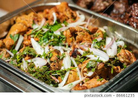 Fried grilled pork chops with caramelized onions 86661235