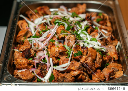 Fried grilled pork chops with caramelized onions Fried grilled pork chops with caramelized onions 86661246