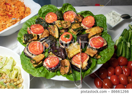 Fried eggplants in a frying pan. Fried eggplants in a frying pan. 86661266