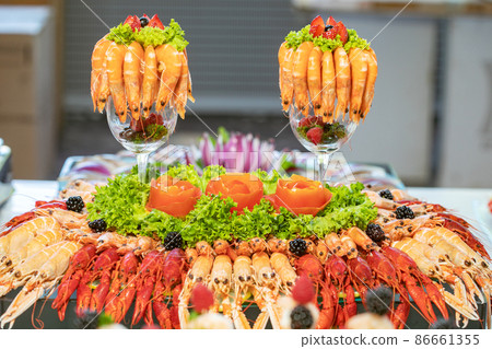 variety of seafood on a plate ready to eat variety of seafood on a plate ready to eat 86661355