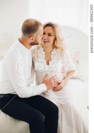 Beautiful couple embracing stomach and touching 86662305