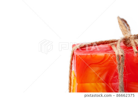 Color handmade soap tied with twine on white background 86662375