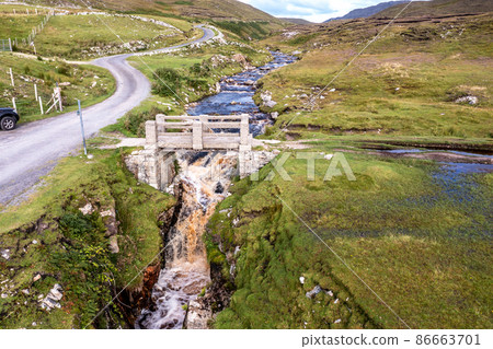 Waterfall at An Port between Ardara and Glencolumbkille in County Donegal - Ireland. 86663701