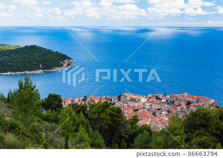 Dubrovnik's old town seen from the road to the summit of Mount Srđ in Croatia Dubrovnik's old town seen from the road to the summit of Mount Srđ in Croatia 86663794