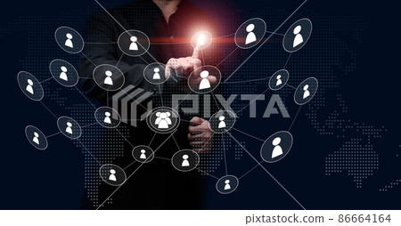 a man in a black suit stands in front of a virtual screen with icons of people. The concept of holding an online meeting, the selection of international staff 86664164