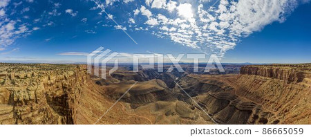 View over San Juan river canyon in Utah from Muley Point near Monument Valley with spectacular cloud formation 86665059