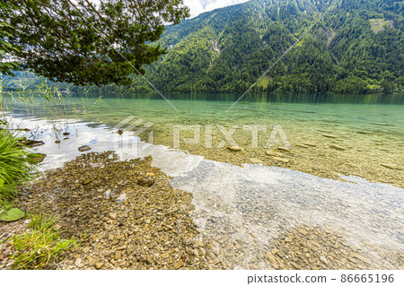 Picture of pretty Weissensee lake in Austria in summer Picture of pretty Weissensee lake in Austria in summer 86665196