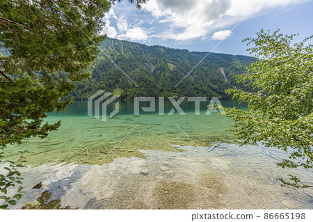 Picture of pretty Weissensee lake in Austria in summer Picture of pretty Weissensee lake in Austria in summer 86665198