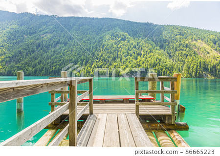 Picture of boat landing stage at lake Weissensee in Austria in summer Picture of boat landing stage at lake Weissensee in Austria in summer 86665223