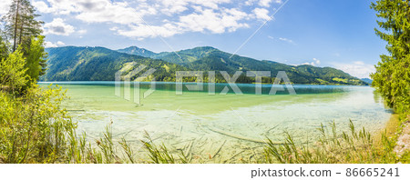 Panoramic view over lake Weissensee in Austria in summer during daytime Panoramic view over lake Weissensee in Austria in summer during daytime 86665241