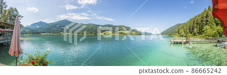 Panoramic view over lake Weissensee in Austria in summer during daytime Panoramic view over lake Weissensee in Austria in summer during daytime 86665242