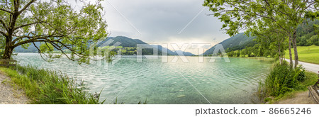 Panoramic view over lake Weissensee in Austria in summer during daytime Panoramic view over lake Weissensee in Austria in summer during daytime 86665246