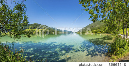 Panoramic view over lake Weissensee in Austria in summer during daytime Panoramic view over lake Weissensee in Austria in summer during daytime 86665248