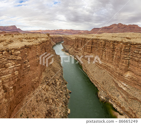 Panoramic view on green colored colorado river from Navajo bridge in winter 86665249