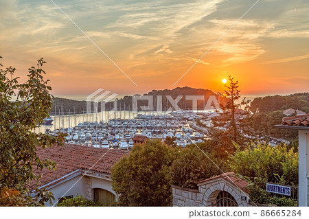 Panorama over the harbor of the Croatian coastal town Vrsar taken from the old town during the sunset 86665284