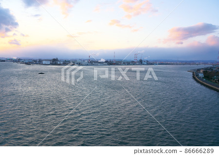 Asahi River estuary and Kojima Bay coastal industrial zone at dusk seen from Kojimawan Bridge 1 Minami-ku, Okayama City, Okayama Prefecture 86666289